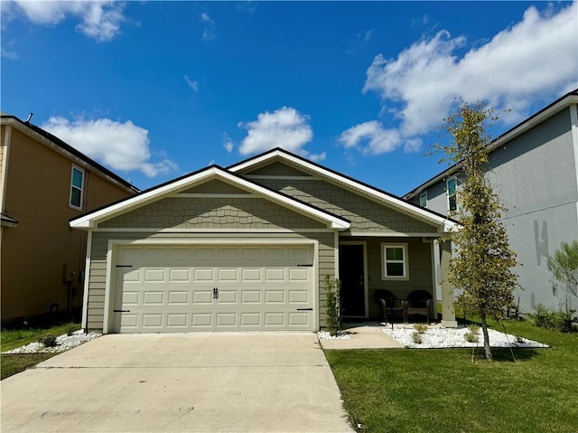 view of front facade with a garage and a front yard