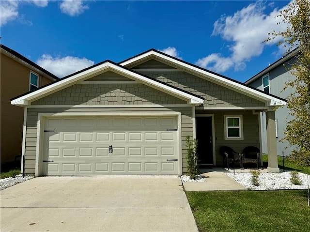 view of front facade with a garage and covered porch