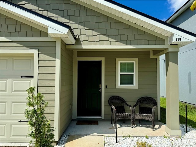 doorway to property featuring a porch