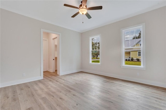 spare room featuring ceiling fan and light hardwood / wood-style flooring