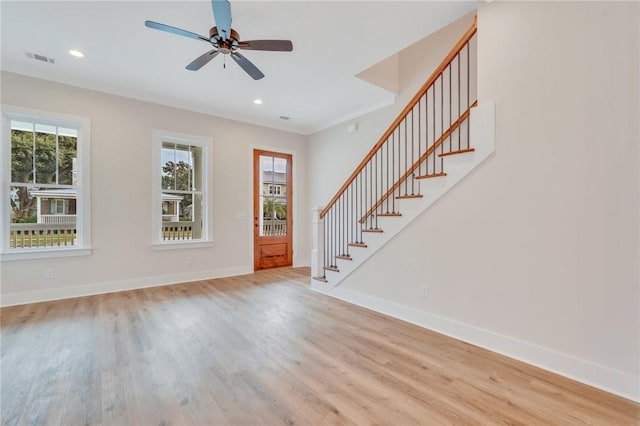 entryway featuring ceiling fan and light hardwood / wood-style floors