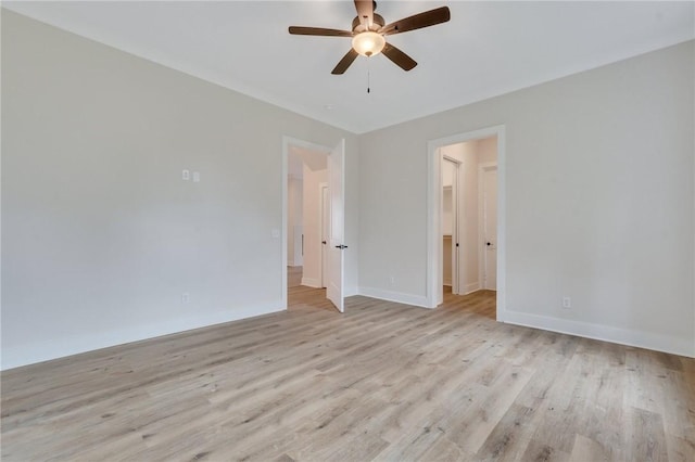 empty room featuring light hardwood / wood-style floors and ceiling fan