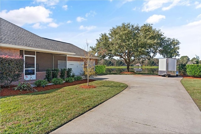 exterior space with a yard and a garage