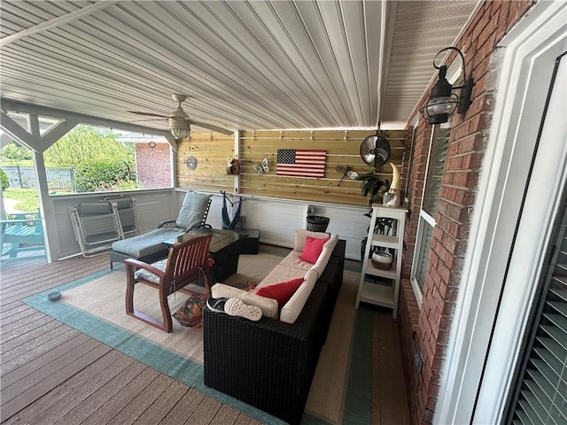 wooden deck with ceiling fan and an outdoor hangout area