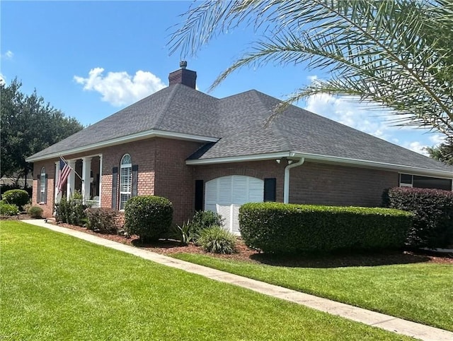 view of side of home featuring a yard