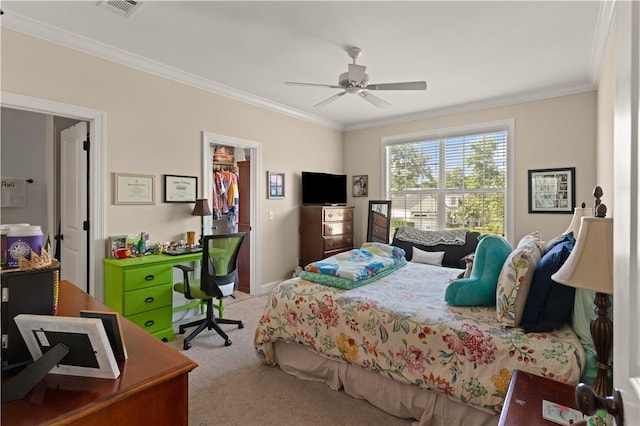 19 Sinclair Way, Saint Simons Island, GA 31522 - bedroom with light carpet, ceiling fan, crown molding, a spacious closet, and a closet