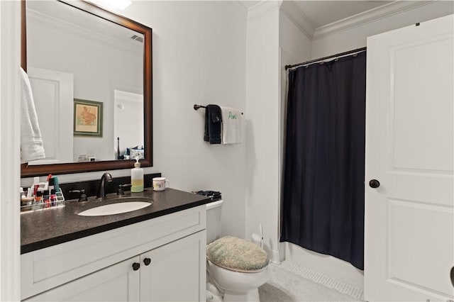 19 Sinclair Way, Saint Simons Island, GA 31522 - bathroom featuring vanity, toilet, and ornamental molding