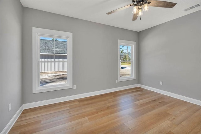 spare room with ceiling fan and light hardwood / wood-style floors