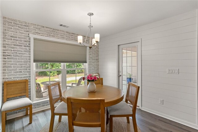 116 Heatherly Way, Brunswick, GA 31523 - dining room featuring dark wood-style flooring, a chandelier, baseboards, and baseboard heating