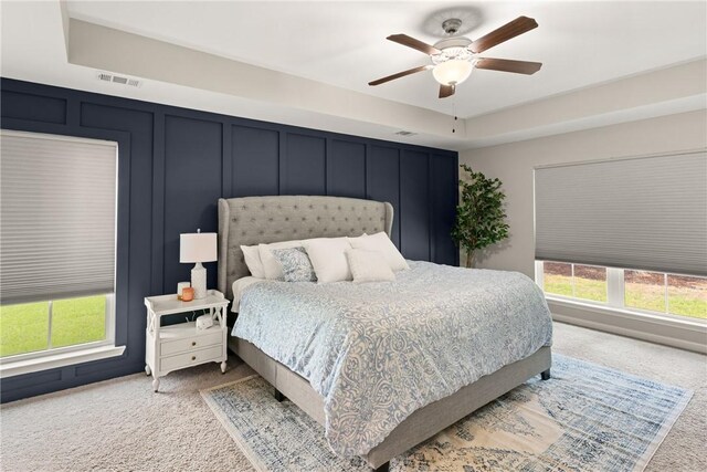 116 Heatherly Way, Brunswick, GA 31523 - carpeted bedroom with a ceiling fan and a decorative wall