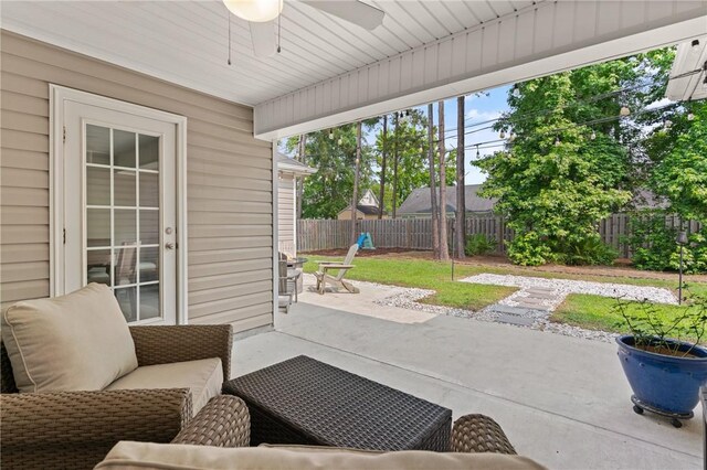 116 Heatherly Way, Brunswick, GA 31523 - fenced backyard with ceiling fan, a patio, and an outdoor living space