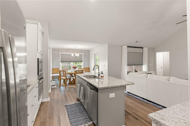116 Heatherly Way, Brunswick, GA 31523 - kitchen with appliances with stainless steel finishes, a sink, light wood finished floors, and white cabinetry