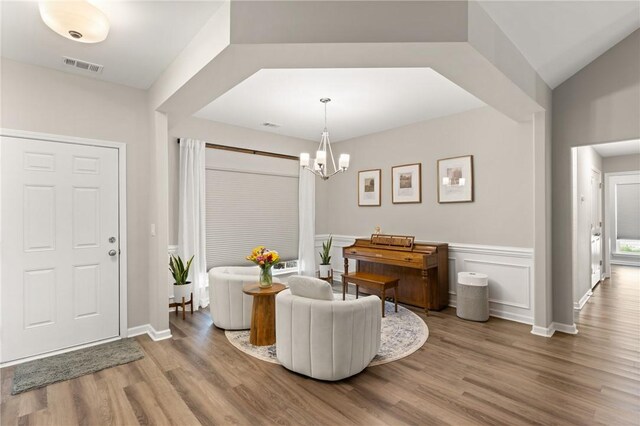 116 Heatherly Way, Brunswick, GA 31523 - entrance foyer featuring wood finished floors, a chandelier, and baseboards