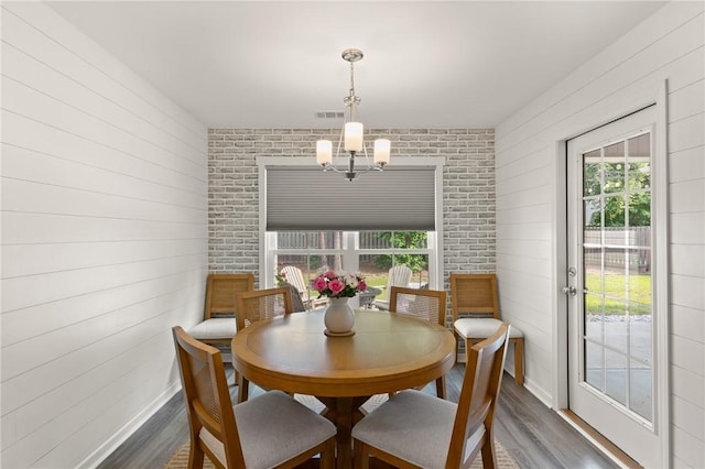 116 Heatherly Way, Brunswick, GA 31523 - dining area featuring dark wood finished floors, healthy amount of natural light, and a chandelier