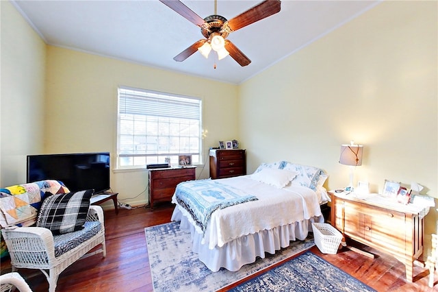 bedroom with ceiling fan and dark hardwood / wood-style flooring