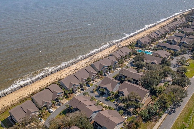 aerial view with a water view and a view of the beach