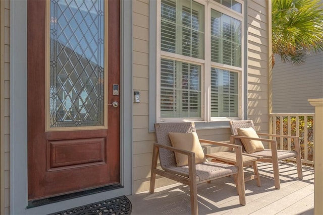 view of exterior entry with covered porch