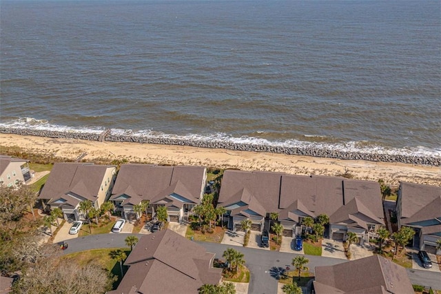 bird's eye view featuring a water view and a view of the beach