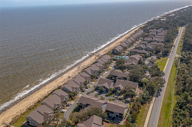 bird's eye view featuring a water view and a view of the beach