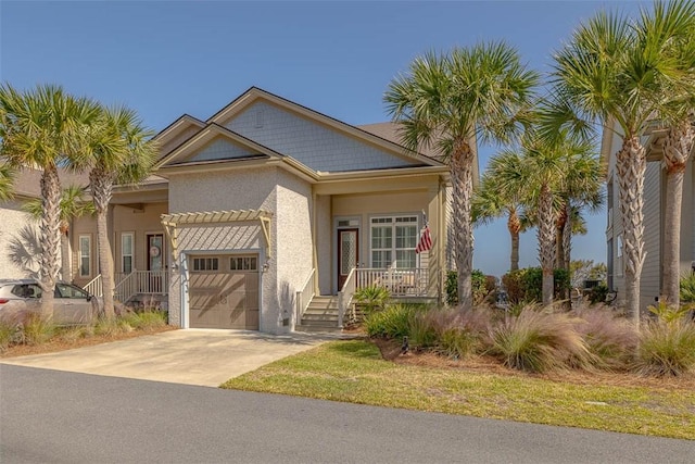 view of front of home featuring covered porch and a garage