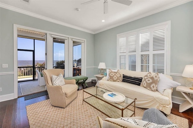 living room with crown molding, ceiling fan, and hardwood / wood-style flooring