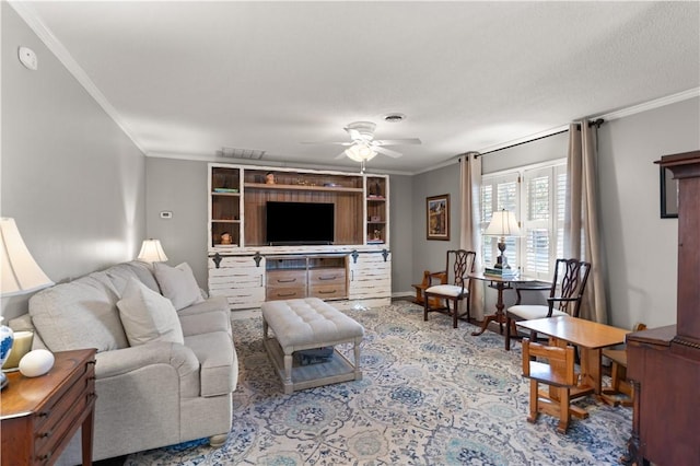 carpeted living room featuring crown molding and ceiling fan