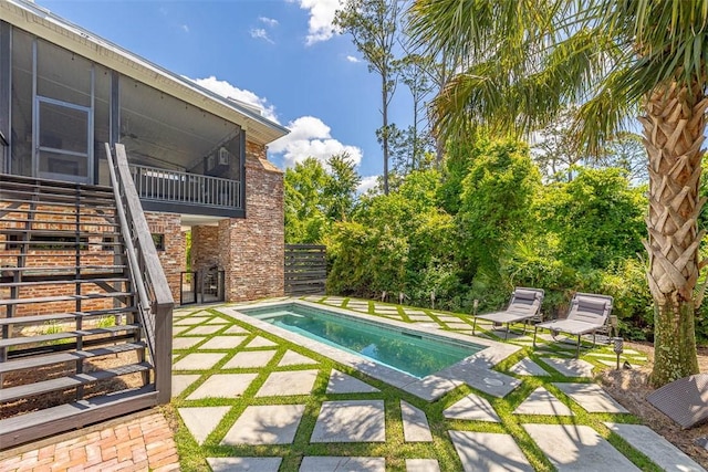 10 Fern Ln, Saint Simons Island, GA 31522 - outdoor pool featuring stairs, a patio, and a sunroom