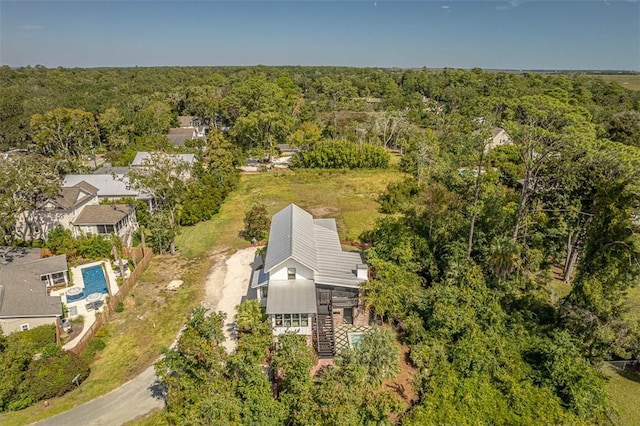 10 Fern Ln, Saint Simons Island, GA 31522 - aerial view of property and surrounding area featuring a heavily wooded area