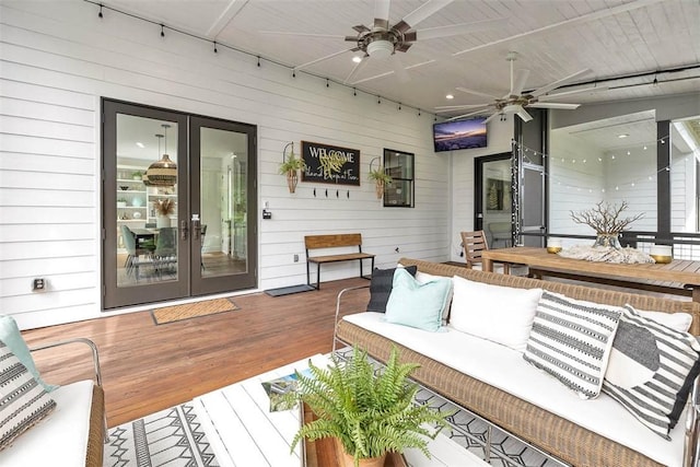 10 Fern Ln, Saint Simons Island, GA 31522 - wooden deck with french doors, an outdoor living space, and ceiling fan