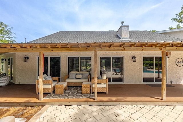 19 Wimbledon Ct, Saint Simons Island, GA 31522 - back of house with a deck, a shingled roof, and stucco siding