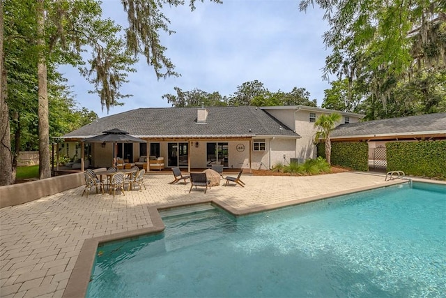 19 Wimbledon Ct, Saint Simons Island, GA 31522 - view of swimming pool with a patio area