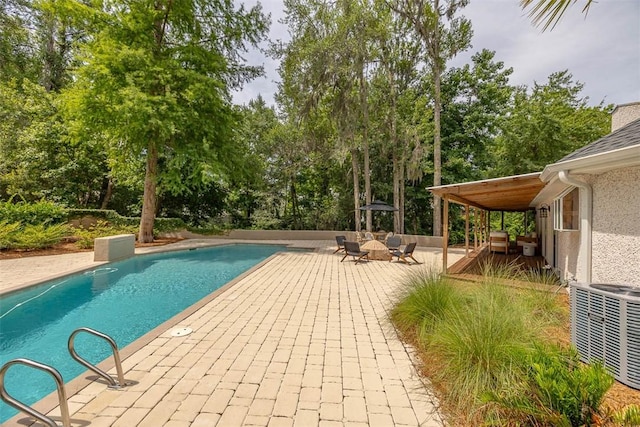 19 Wimbledon Ct, Saint Simons Island, GA 31522 - outdoor pool with a patio, view of scattered trees, and outdoor lounge area