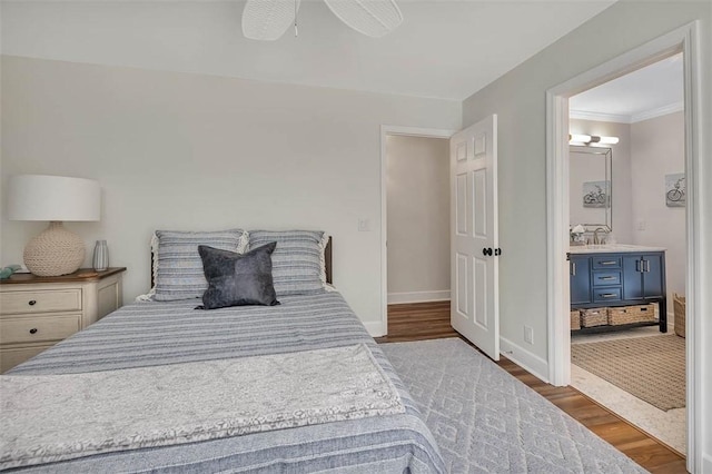 19 Wimbledon Ct, Saint Simons Island, GA 31522 - bedroom with wood finished floors, crown molding, ceiling fan, and ensuite bathroom
