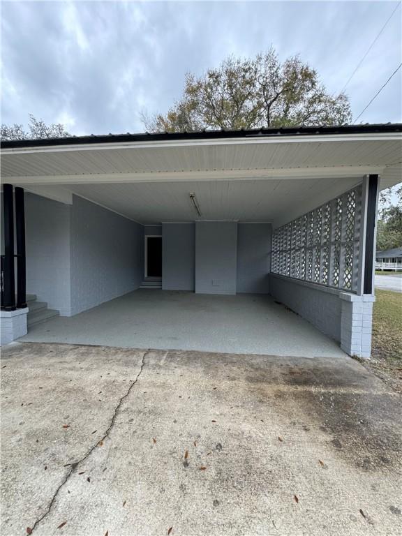 view of parking / parking lot with a carport