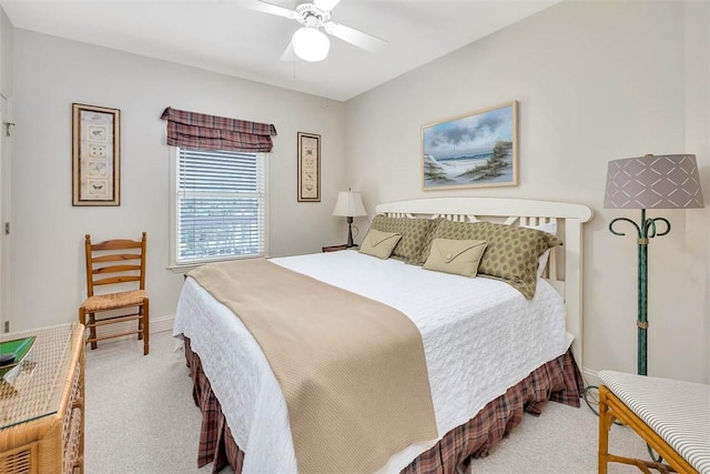 bedroom with light carpet and ceiling fan