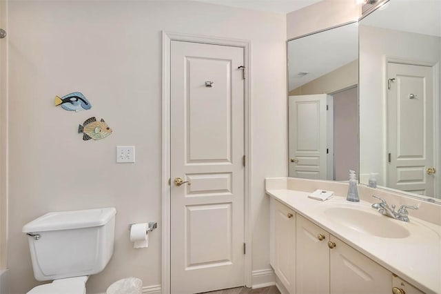 bathroom featuring vanity and toilet