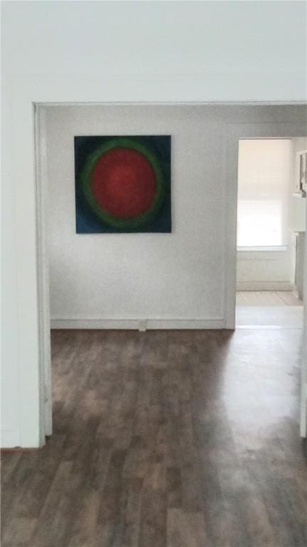 605 Walker St, Waycross, GA 31503 - hallway featuring baseboards and wood finished floors