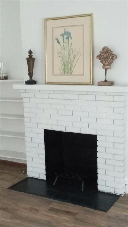 605 Walker St, Waycross, GA 31503 - detailed view of a fireplace and wood finished floors