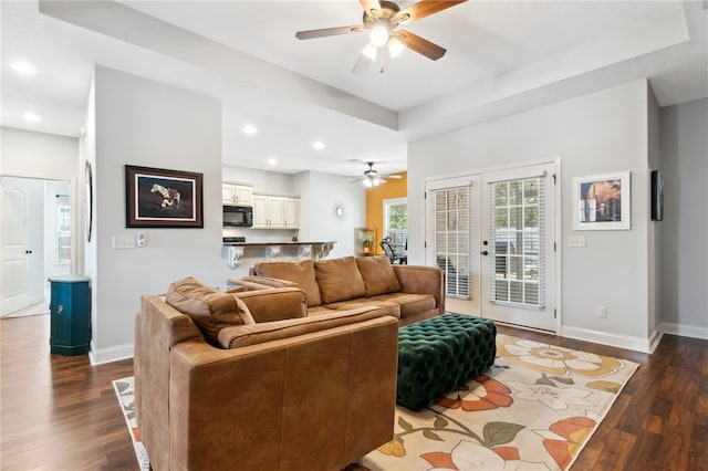 living area with french doors, baseboards, and dark wood-style flooring