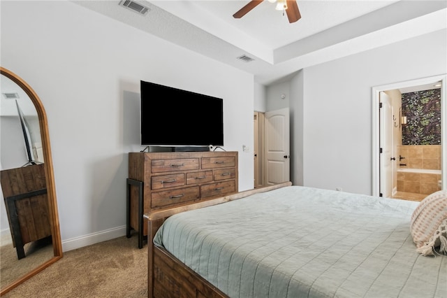 bedroom featuring carpet floors, ensuite bath, baseboards, and visible vents