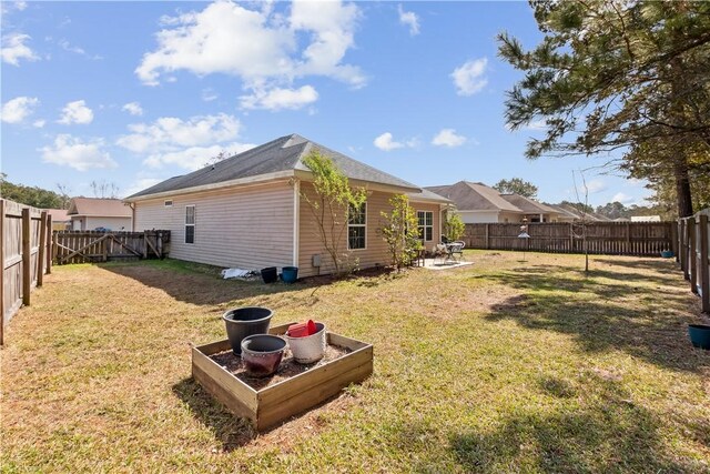 exterior space featuring a fenced backyard and a patio