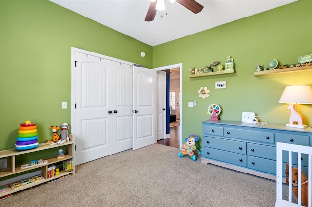 recreation room with ceiling fan and carpet floors