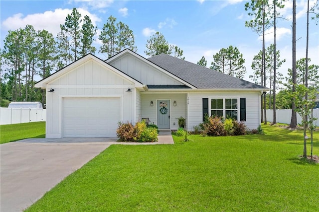 1616 Ashantilly Dr, Darien, GA 31305 - view of front of house with driveway, board and batten siding, an attached garage, and roof with shingles