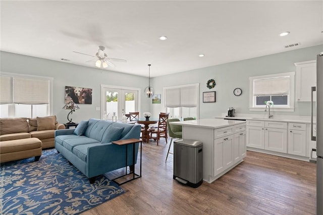 1616 Ashantilly Dr, Darien, GA 31305 - living room featuring ceiling fan, french doors, wood finished floors, and recessed lighting