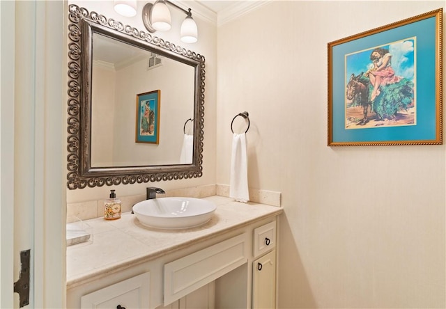 bathroom with visible vents, ornamental molding, and vanity