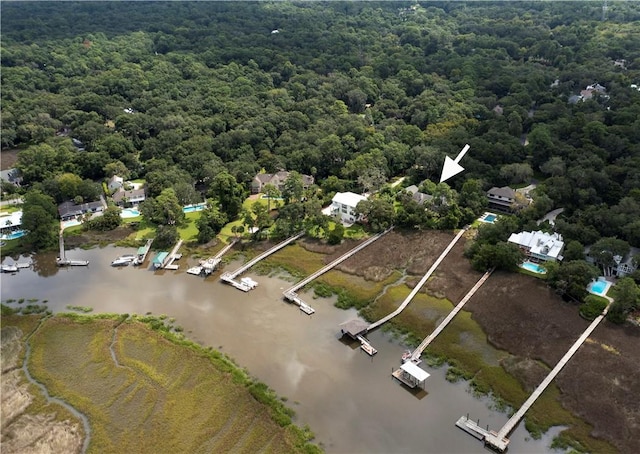 aerial view featuring a water view and a wooded view