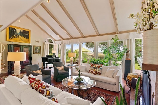 sunroom / solarium with vaulted ceiling with beams and a healthy amount of sunlight