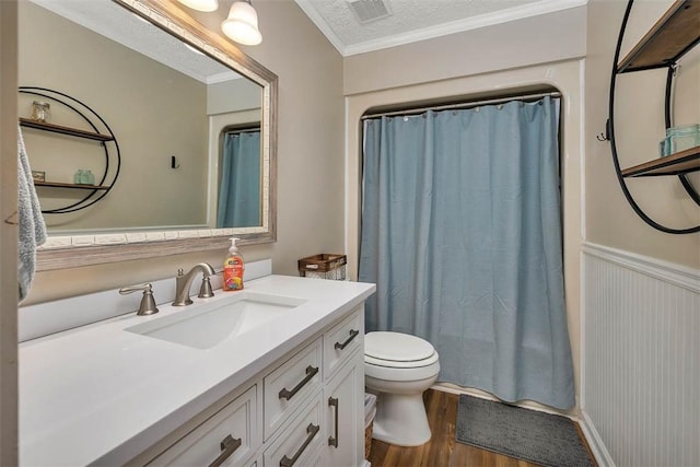 103 Travellers Way, Saint Simons Island, GA 31522 - bathroom featuring vanity, wood finished floors, crown molding, a shower with shower curtain, and a textured ceiling