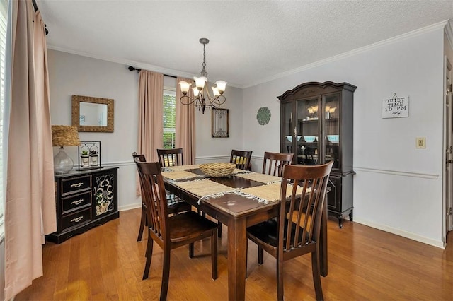 103 Travellers Way, Saint Simons Island, GA 31522 - dining area with a chandelier, wood finished floors, and crown molding