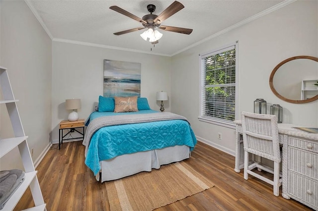 103 Travellers Way, Saint Simons Island, GA 31522 - bedroom with wood finished floors, crown molding, a ceiling fan, and a textured ceiling